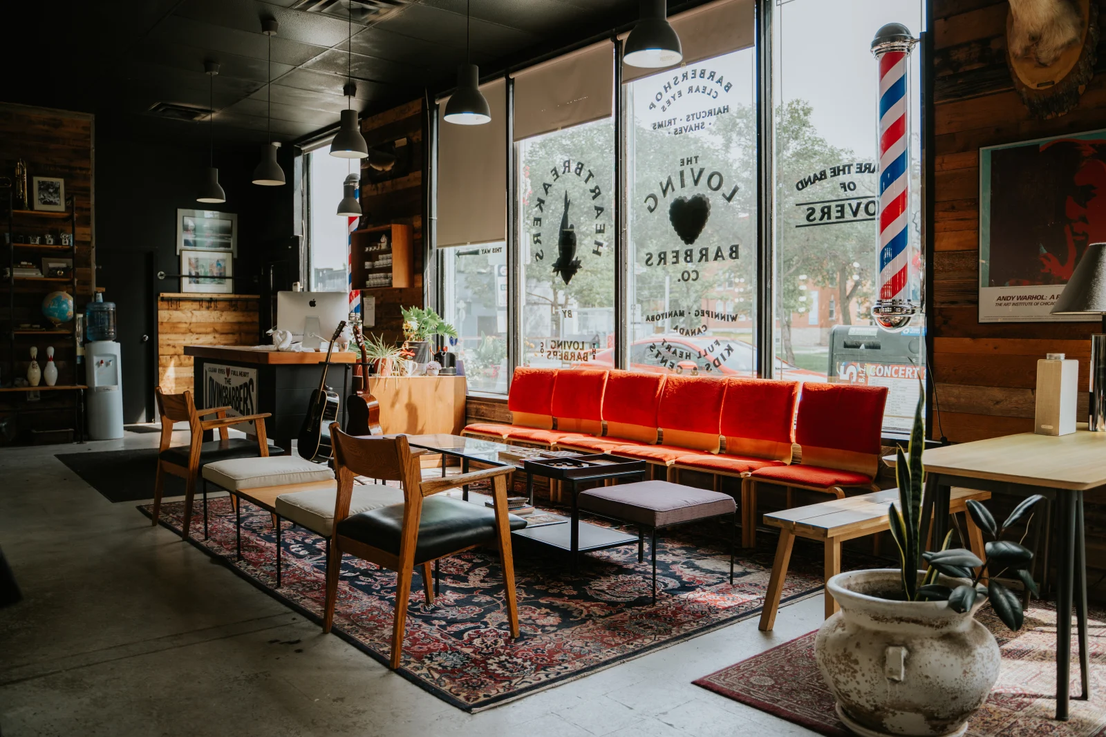Sunlight falling across the chairs and front windows of a Corydon Avenue barbershop